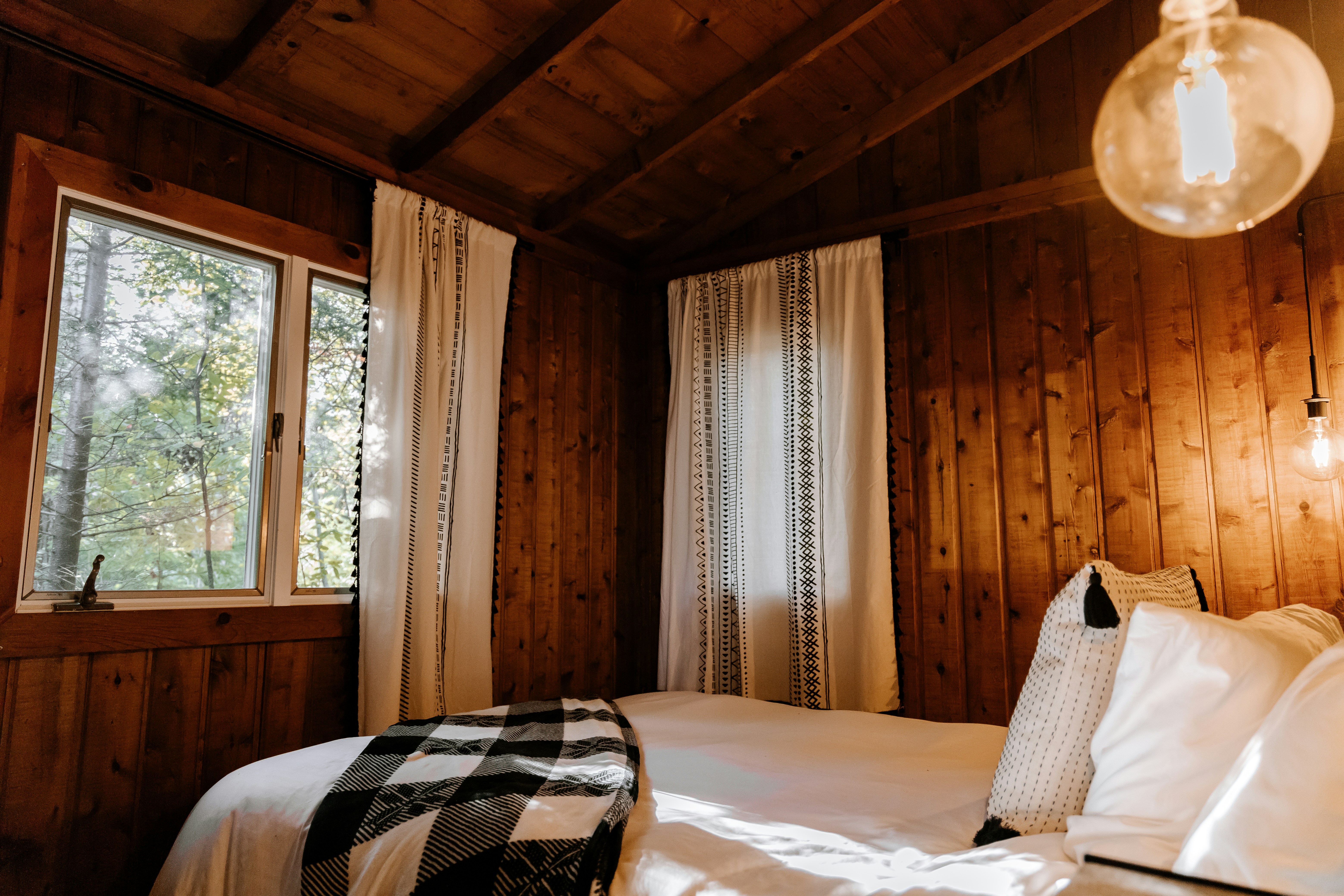 A wooden lodge bedroom with linen